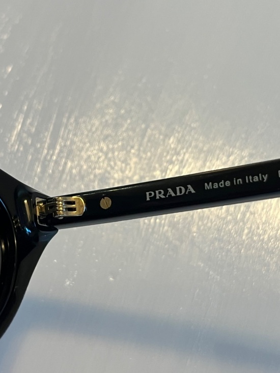 Prada sunglasses with the iconic metal plaque